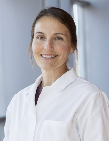 headshot women in white coat